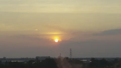The sun was setting, evening, and there was a haze rising Stock Footage 305899388