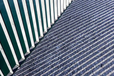 Sun White lines flow on black asphalt. The white lines against the black asphalt Stock Photos