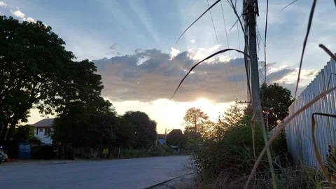 The sun will set.  Shining through the clouds Stock Footage 260387434