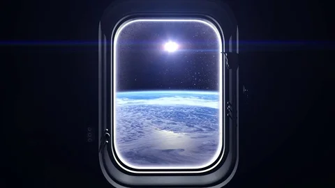 The sun in the window of the spacecraft. The view from space. Sunrise over the Stock Footage 74897355