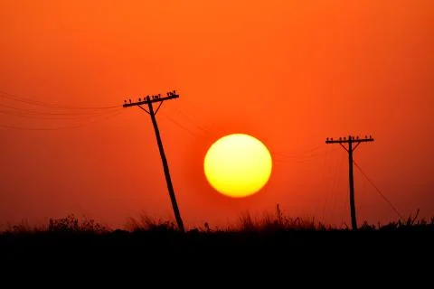 A sun on the wires between the two poles Stock Photos