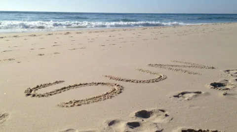 Sun word in sand Stock Footage 37388338