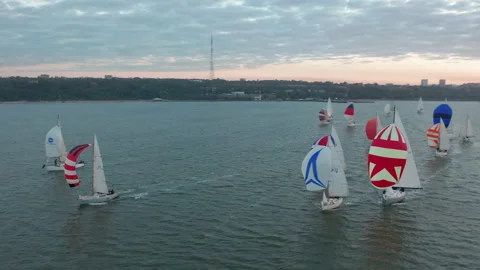 Sun yachts with white sails in open sea aerial. Sailing seascape at summer sunny Vídeo Stock 151246535