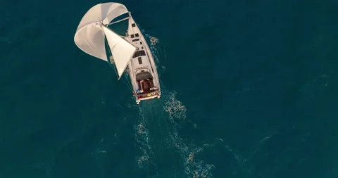 Sun yachts with white sails in open sea aerial. Sailing seascape at summer sunny Vídeo Stock 151470408