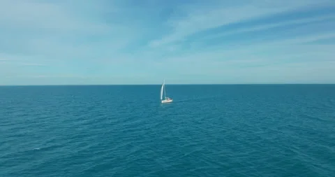Sun yachts with white sails in open sea aerial. Sailing seascape at summer sunny Stock Footage 151534452