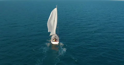 Sun yachts with white sails in open sea aerial. Sailing seascape at summer sunny Stock-Footage 151645254