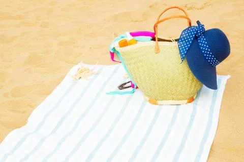 Sunbathing accessories on sandy beach Stock Photos