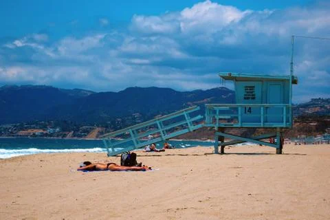 Sunbathing in the beach Stock Photos