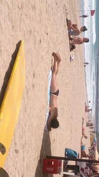 Sunbathing on the beach Stock Photos
