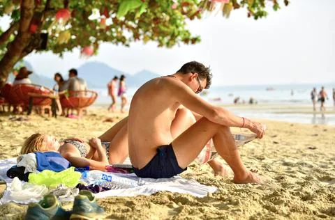 Sunbathing on the beach Stock Photos