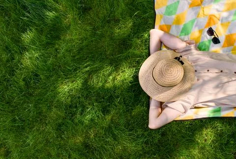 Sunbathing on Grass with Hat Stock Photos