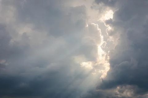 Sunbeam between storm clouds cloudscape sky Stock Photos
