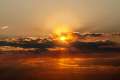 Sunbeam of light breaks through thunderclouds during sunset Stock-Fotos