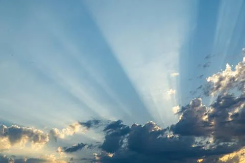 Sunbeam in Partly Cloudy Sky Stock Photos