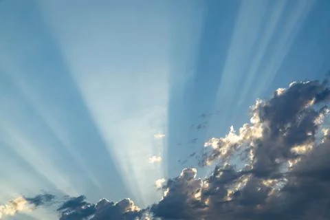 Sunbeam in Partly Cloudy Sky Stock Photos