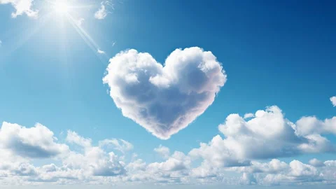 Sunbeam reveals a heart cloud framed by vibrant blue Video stock 317167433