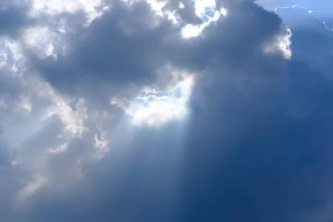 Sunbeam, sunlight through the haze, cloud on the blue sky . Cloud with sun ra 写真素材