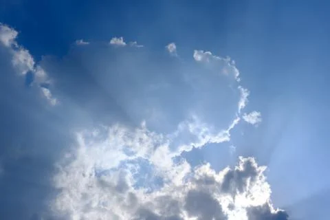 Sunbeam, sunlight through the haze, cloud on the blue sky . Cloud with sun ra Foto stock