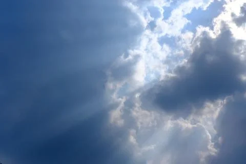 Sunbeam, sunlight through the haze, cloud on the blue sky . Cloud with sun ra Stock Photos