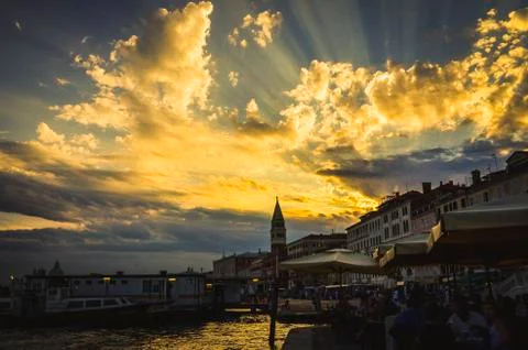Sunbeam through the clouds in vacation time in venice in a scenic dawn with w Stock Photos