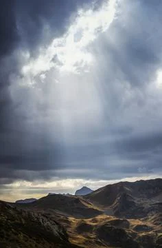 Sunbeams are seen through cloudy sky in Caucasus national park Stock Photos