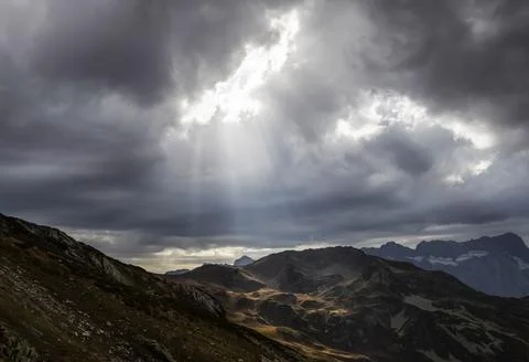 Sunbeams are seen through cloudy sky in Caucasus national park Stock Photos
