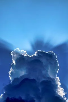 Sunbeams behind the clouds Stock Photos