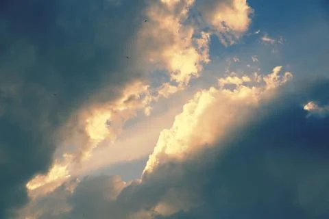 Sunbeams breaking through the clouds Stock Photos