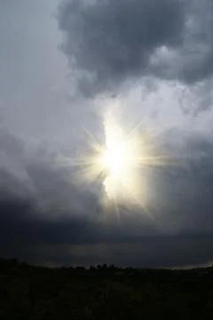 Sunbeams breaking through the clouds Foto stock