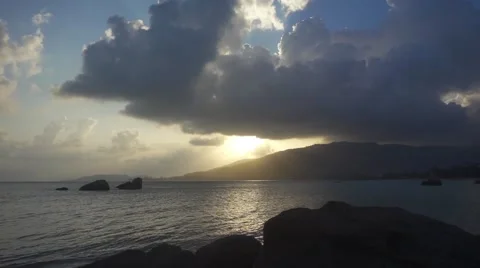 Sunbeams Breaking Through the Clouds at Sunset over the Mountain. Slow Motion Stock Footage 66342862