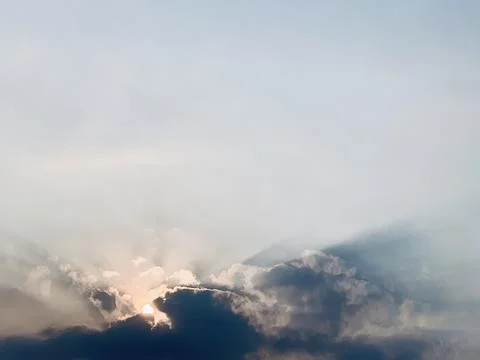 Sunbeams Breaking Through Dark Clouds at Dusk Jakarta Indonesia Stock Photos