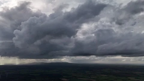 Sunbeams Breaking Through Dramatic Storm Clouds Over Landscape Stock Footage 337852037