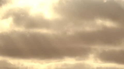 Sunbeams with bright clouds in the morning sky - 4k Real Time Video Stock Footage 108099276