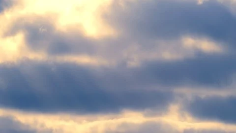 Sunbeams with bright clouds in the morning sky - 4k Real Time Video Stock Footage 108099287