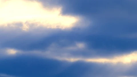Sunbeams with bright clouds in the morning sky - 4k Real Time Video Stock Footage 108108831