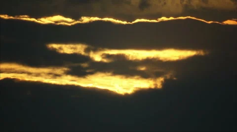 Sunbeams on clouds at sunrise Stock Footage 58738918