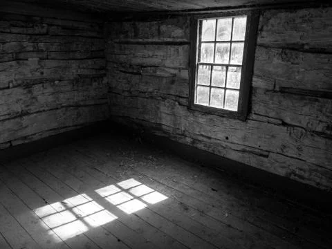 Sunbeams in Empty Old Log Cabin, Black and White Stock Photos