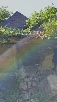 Sunbeams filter through a ruined, collapsing traditional mudbrick house Stock Photos