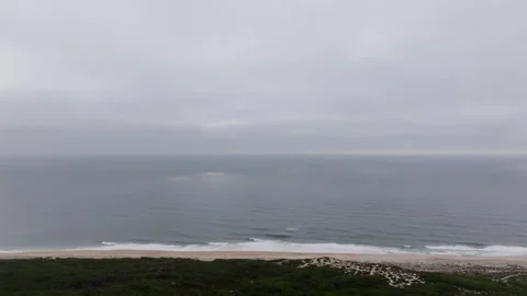 Sunbeams illuminating ocean waves on a cloudy day Stock-Footage 300624488