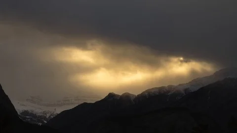 Sunbeams in the mountains on moody evening 8K Stock-Footage 124424809