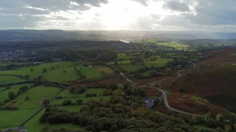 Sunbeams moving across rural patchwork countryside meadow farmland Stock Footage 141877070