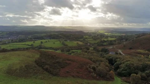 Sunbeams moving across rural patchwork countryside meadow farmland Stock Footage 141877099