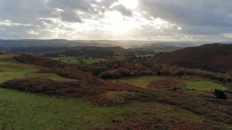 Sunbeams moving across rural patchwork countryside meadow farmland Stock Footage 141877225