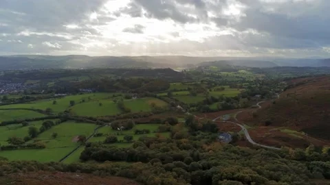 Sunbeams moving across rural patchwork countryside meadow farmland Stock Footage 141877257