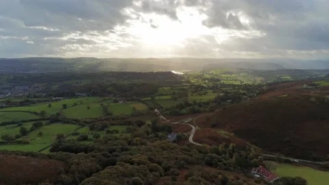 Sunbeams moving across rural patchwork countryside meadow farmland Video stock 141877265