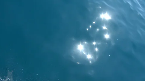 Sunbeams on the passing sea surface Stock Footage 128375720