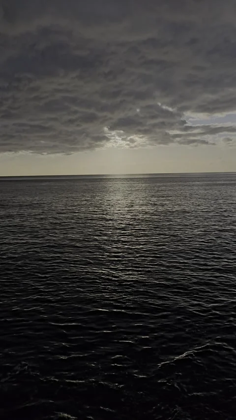 Sunbeams pierce the Atlantic haze over Câmara de Lobos Stock Footage 310024723