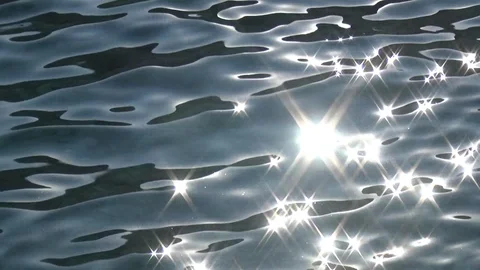 Sunbeams reflecting sea surface close up Stock Footage 127242700