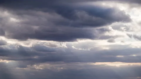 Sunbeams Shine Behind the Amazing Dramatic Storm Clouds in the Sky. Time lapse. Video stock 140506549