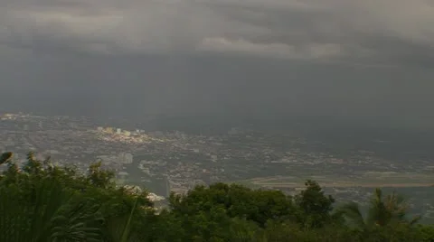 Sunbeams Shine through the Clouds in a Tropical City Video stock 11236564